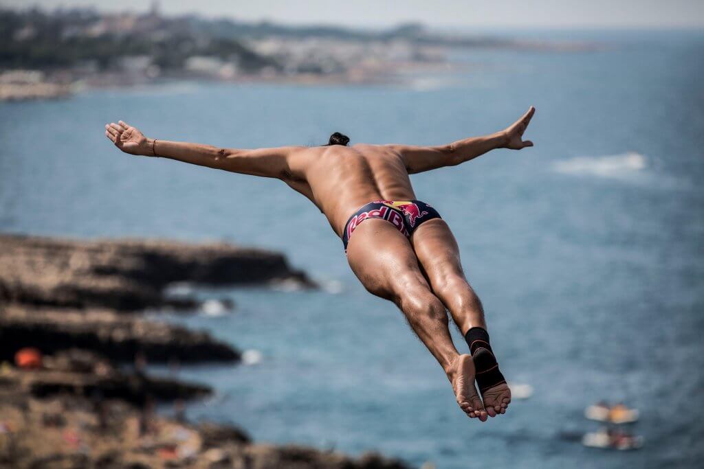 Orlando Duque of Colombia dives from the 27 metre platform during the first competition day of the third stop of the Red Bull Cliff Diving World Series at Polignano a Mare, Italy on July 22 2017.